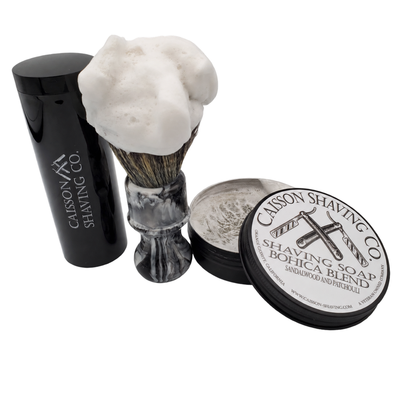 Caisson Bohica Blend shaving soap with a lathered 24mm synthetic brush and travel container.