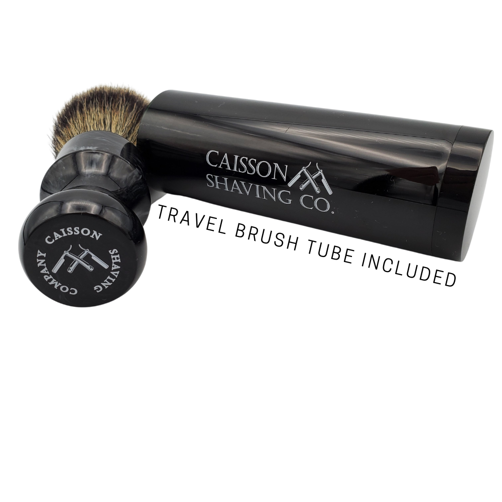 Caisson 24mm synthetic shaving brush and travel container with shaving soap.
