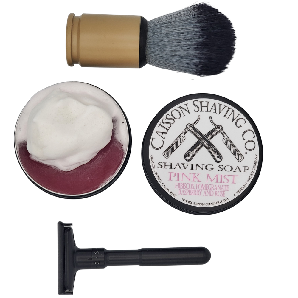 Overhead view of Pink Mist shaving soap, brush and safety razor.