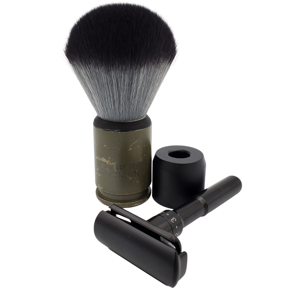 Caisson safety razor and stand pictured with a shaving brush.